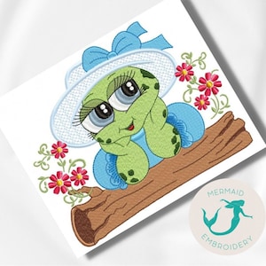 May include: A green turtle wearing a blue dress and a white hat with a blue bow sits on a brown log. Pink flowers with green stems are behind the turtle.