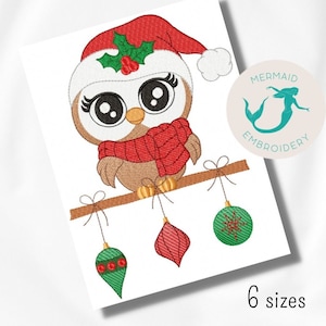 May include: Embroidered design of a brown owl wearing a red Santa hat with holly and a red scarf, perched on a branch with three hanging ornaments: a red, a green, and a green with white snowflake.