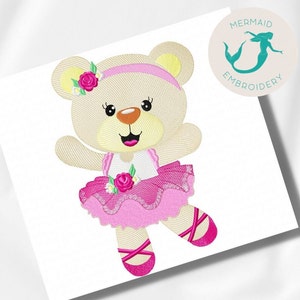 May include: A pink ballerina teddy bear with a pink tutu, a pink headband, and pink shoes. The bear has a happy expression and is holding its arms out.