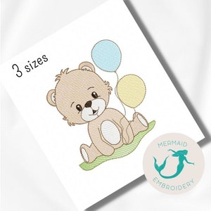 May include: Embroidered design of a brown teddy bear sitting on a green patch of grass, holding three balloons: blue, yellow, and light blue. The text "3 sizes" is in the top left corner of the image. The image is from Mermaid Embroidery.