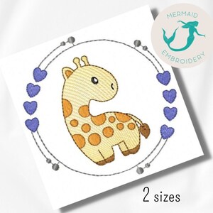 May include: An embroidered design featuring a cartoon giraffe with orange spots, surrounded by a circle of blue hearts and silver beads. The design is on a white background, with the text "2 sizes" at the bottom.