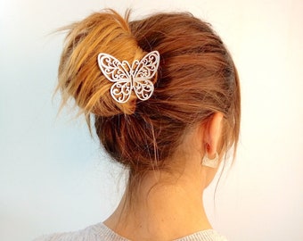 ALBA - Stunning openwork design butterfly with sinuous lines. This hairpin achieves a nice transparency effect embellishing your hair