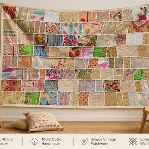 May include: A rectangular wall hanging tapestry featuring a patchwork design of various fabric squares in shades of gold, pink, green, and blue. The textile displays intricate embroidery, floral patterns, and paisley motifs. It measures 152 x 102 cm.