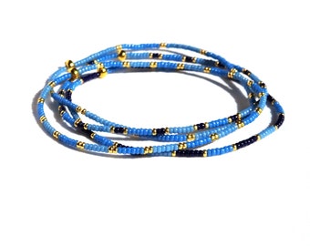Thin miyuki stretch bracelet set of tiny beads in blue and gold color, minimalist style