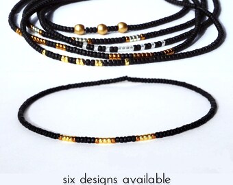 Thin glass stretch bracelet of tiny rocailles in black and gold, bronze, silver or white color beads, light, comfortable, seed beads