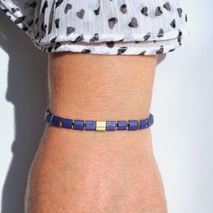 Glass tile stretch bracelet with dark blue and gold plated miyuki tila beads and tiny rocailles