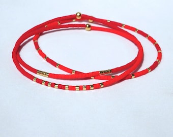 Delicate miyuki stretch bracelet in red with gold color accents, single or a set of bracelets, comfortable and light