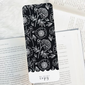 May include: Black and white bookmark with a floral pattern and the text "MY SECRET COPY" at the bottom.