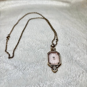 Vintage Avon Frostlights Necklace 1977 | Pink Camphor Glass Pendant with Rhinestone Starburst Accent | Gold Tone Victorian Art Deco Revival