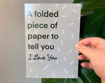 A folded piece of paper to tell you I love you greeting card for him and for her