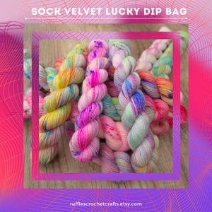 May include: A collection of colorful yarn skeins in shades of pink, yellow, blue, and green. The image features the text "SOCK VELVET LUCKY DIP BAG" at the top and the Etsy shop URL at the bottom. The yarn is arranged in a visually appealing display.