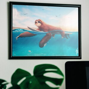 May include: A framed illustration of a brown sloth surfing on a surfboard in blue water with a blue sky and white clouds in the background.