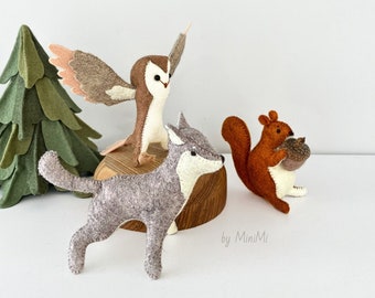 Soft felt toy woodland animals: owl, wolf, squirrel.