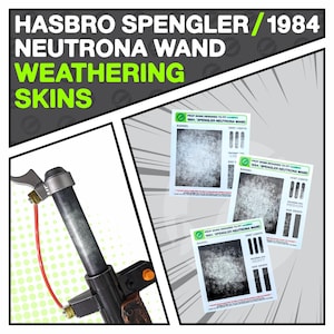 May include: Image of a Hasbro Spengler Neutrona Wand with weathering skins. The image shows the wand's barrel and three cards with different weathering effects: light, medium, and heavy. The text on the cards reads "Prop Skins Designed to Fit Hasbro 1984 Spengler Neutrona Wand".