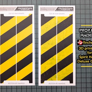 May include: Two prop decals with black and yellow diagonal stripes, designed to fit 3D printed doors for the Spirit Halloween Deluxe Ghost Trap. Text on the decals reads "TOP BY BAR GRAPH" and "BOTTOM BY HANDLE".