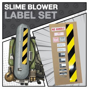 May include: An illustration of a Slime Blower Label Set. The image shows a gray and green backpack-like device with yellow and black stripes. A cardboard sheet displays various labels with text including "NO HANDLE" and "CAUTION".