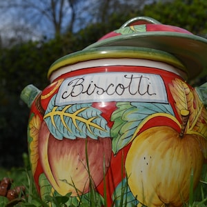 Tuscan ceramic cookie jar handmade, hand painted ina traditional design on red background