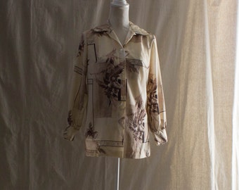 Beige mönstrad långärmad blus från 1970-talet