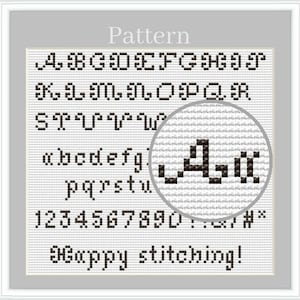 May include: A cross-stitch pattern featuring a black alphabet in uppercase and lowercase letters, numbers 0-9, and symbols on a white grid. The text "Pattern" appears at the top, and "Happy stitching!" is at the bottom. A circular magnifying glass highlights the letter "A".
