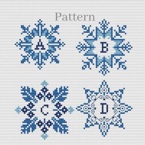 May include: Cross stitch pattern for four snowflakes with letters A, B, C, and D in the center of each snowflake. The snowflakes are in shades of blue on a white background. The word "Pattern" is written above the snowflakes.