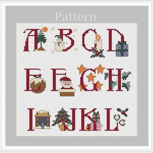 May include: A cross-stitch pattern featuring the letters A through L with Christmas-themed illustrations. The letters are red, and the illustrations include a snowman, a candle, a Christmas tree, a stocking, Santa Claus, a star, a house, and a gift.