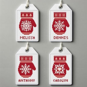 May include: Four white gift tags featuring red and white knitted mitten designs. Each tag has a different name printed below the mitten: Melissa, Dennis, Anthony, and Carolyn.