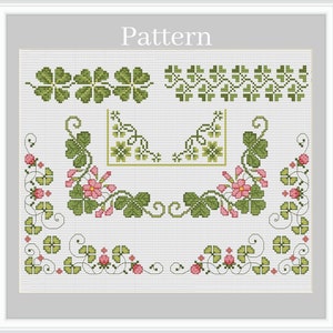 May include: Cross stitch pattern featuring a variety of green four-leaf clover designs with pink flowers and vines. The pattern is labeled "Pattern" at the top.