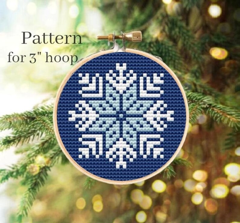 May include: A blue and white snowflake cross-stitch pattern for a 3-inch embroidery hoop.
