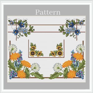 May include: Cross stitch pattern featuring a floral design with sunflowers, dandelions, and blue flowers. The pattern is framed with a brown border and the word "Pattern" is written at the top.