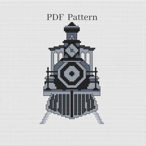 May include: A cross-stitch pattern of a steam train in shades of gray and black. The design features a detailed front with a geometric pattern and the text "PDF Pattern" at the top. The image is on a white background.