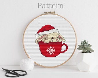 Wzór haftu krzyżykowego na świąteczne króliczki w kubku xstitch