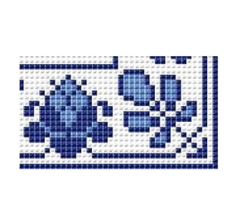 May include: A blue and white cross stitch pattern with two stylized flowers. The flowers are in a blue and white color scheme.