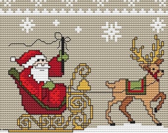 サンタクロースとクリスマスツリーが描かれたクリスマス村のクロス