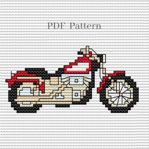 May include: A cross-stitch pattern for a red, white, and black motorcycle. The pattern includes the text "PDF Pattern".