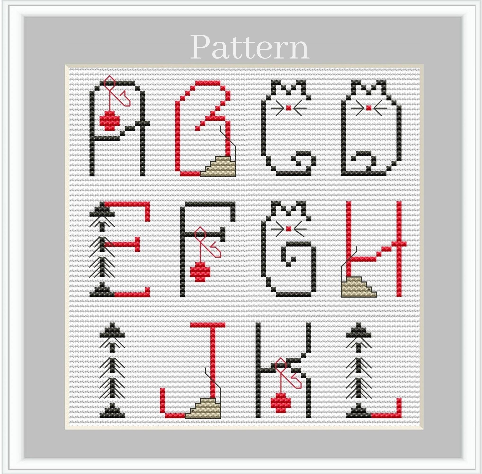 猫の形をした文字と数字を使った猫のアルファベットのクロスステッチ