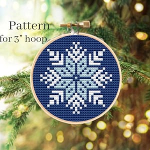 May include: A blue and white snowflake cross stitch pattern for a 3 inch hoop.