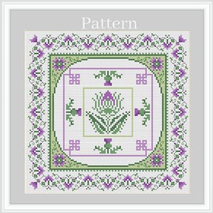 May include: A cross-stitch pattern featuring a purple thistle flower with green leaves and stems. The pattern is surrounded by a border of green and purple leaves and flowers. The word "Pattern" is printed at the top of the image.