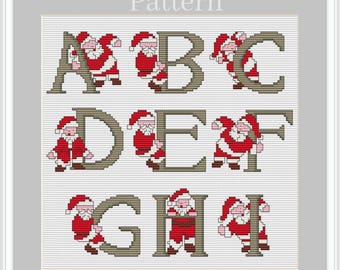 May include: Cross stitch pattern featuring the letters A through I with Santa Claus figures in red and white, and the letters in brown.