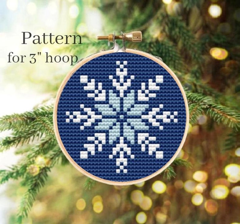 May include: A blue and white snowflake cross stitch pattern for a 3 inch hoop.
