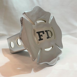 May include: Chrome hitch cover with a fire department emblem featuring a black "FD" in the center.