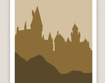 May include: A framed art print featuring a silhouette of a castle with multiple towers and spires, set against a neutral background. The artwork uses shades of brown and tan to depict the castle and the landscape below.