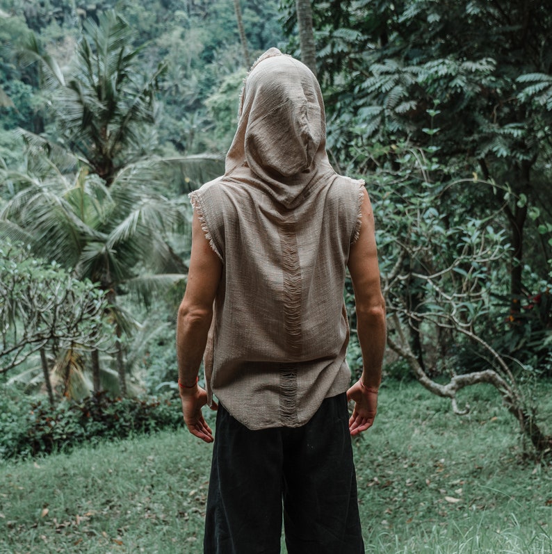 This grey hoodie jacket is a perfect blend of bohemian charm and shamanic essence, designed for those who appreciate the freedom of movement and the allure of tribal aesthetics.