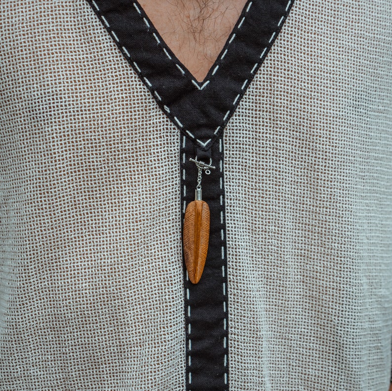 Made from 100% eco-friendly cotton and featuring open-mesh fabric, this shaman shirt ensures breathability and comfort in any setting, from bustling festivals to tranquil daily life.