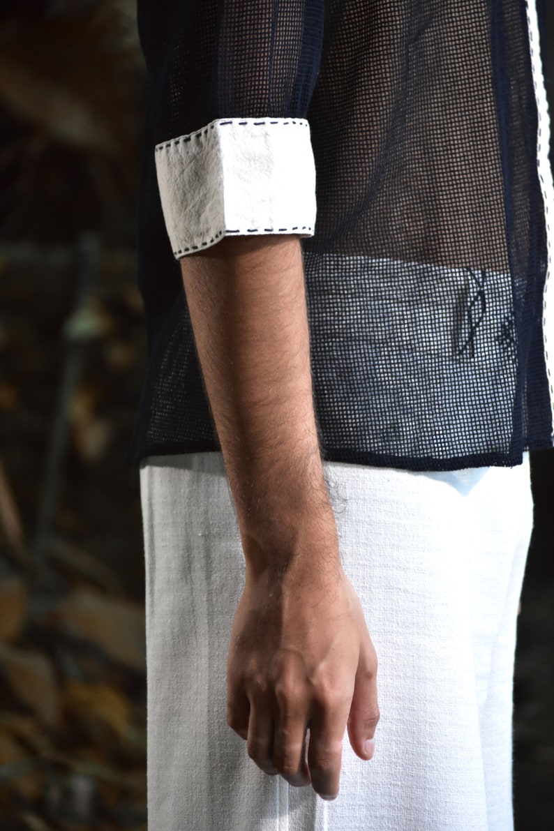 Made from 100% eco-friendly cotton and featuring open-mesh fabric, this shaman shirt ensures breathability and comfort in any setting, from bustling festivals to tranquil daily life