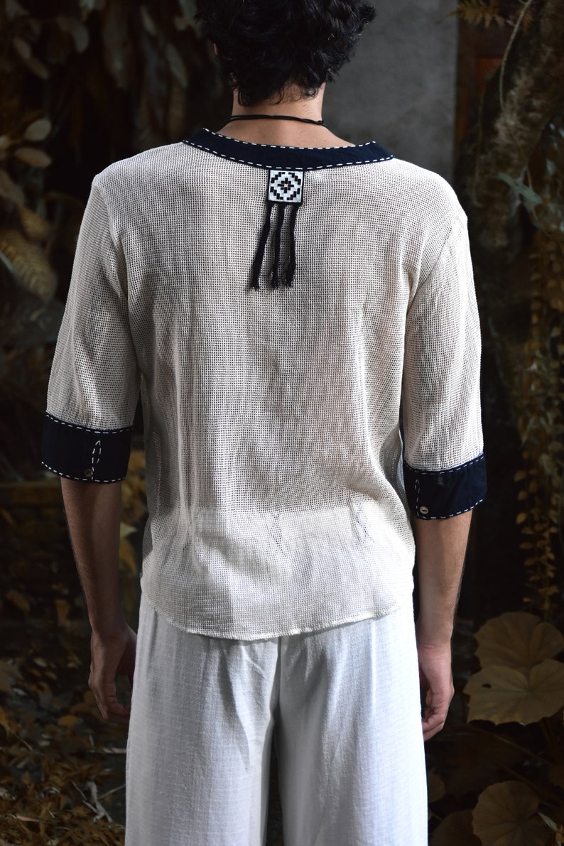 Made from 100% eco-friendly cotton and featuring open-mesh fabric, this shaman shirt ensures breathability and comfort in any setting, from bustling festivals to tranquil daily life.