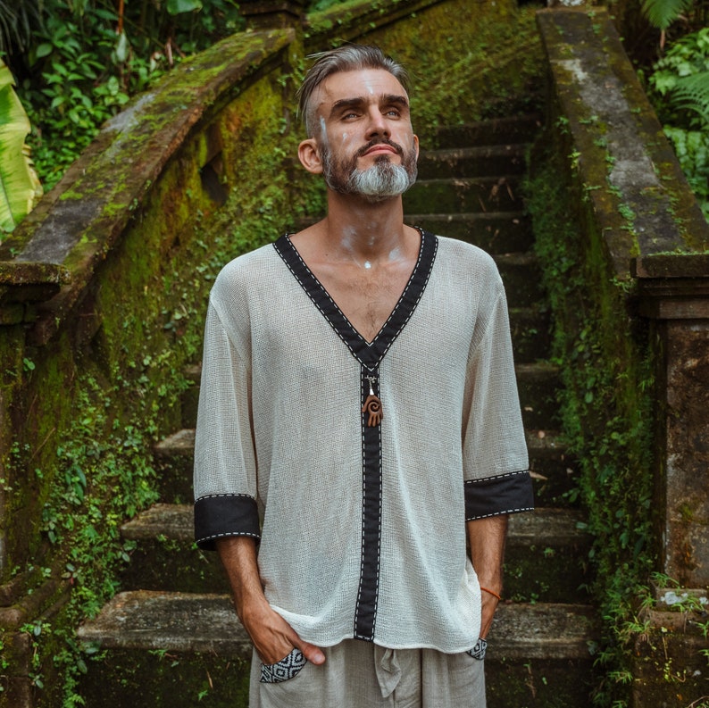 Made from 100% eco-friendly cotton and featuring open-mesh fabric, this shaman shirt ensures breathability and comfort in any setting, from bustling festivals to tranquil daily life.