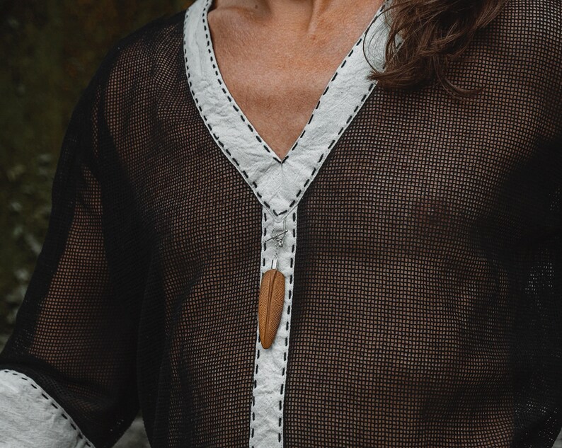 Made from 100% eco-friendly cotton and featuring open-mesh fabric, this shaman shirt ensures breathability and comfort in any setting, from bustling festivals to tranquil daily life