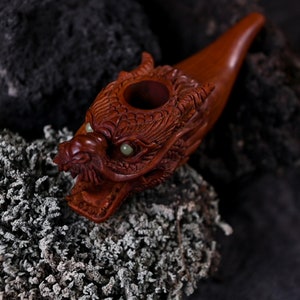 Luxury hand-carved mahogany wood Dragon smoking pipe with Ye Ming Zhu stone, a ceremonial piece for tobacco and herbs, embodying native American medicine traditions