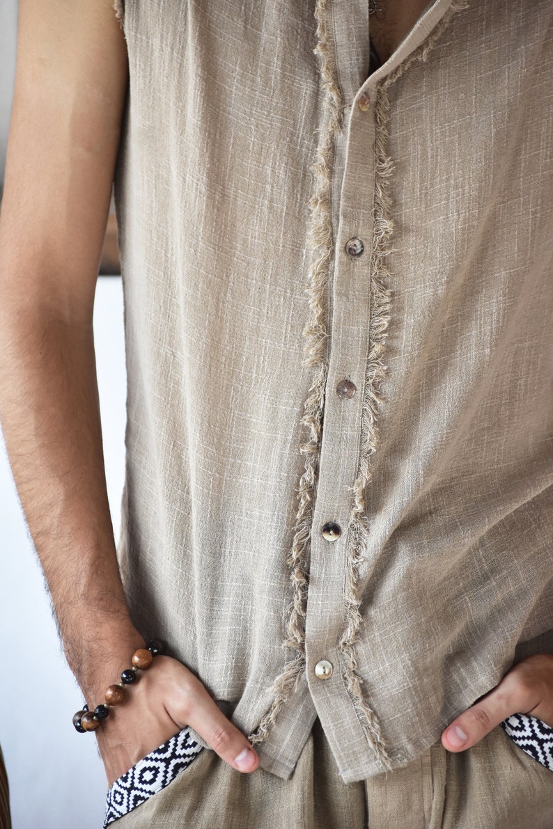 This grey hoodie jacket is a perfect blend of bohemian charm and shamanic essence, designed for those who appreciate the freedom of movement and the allure of tribal aesthetics.