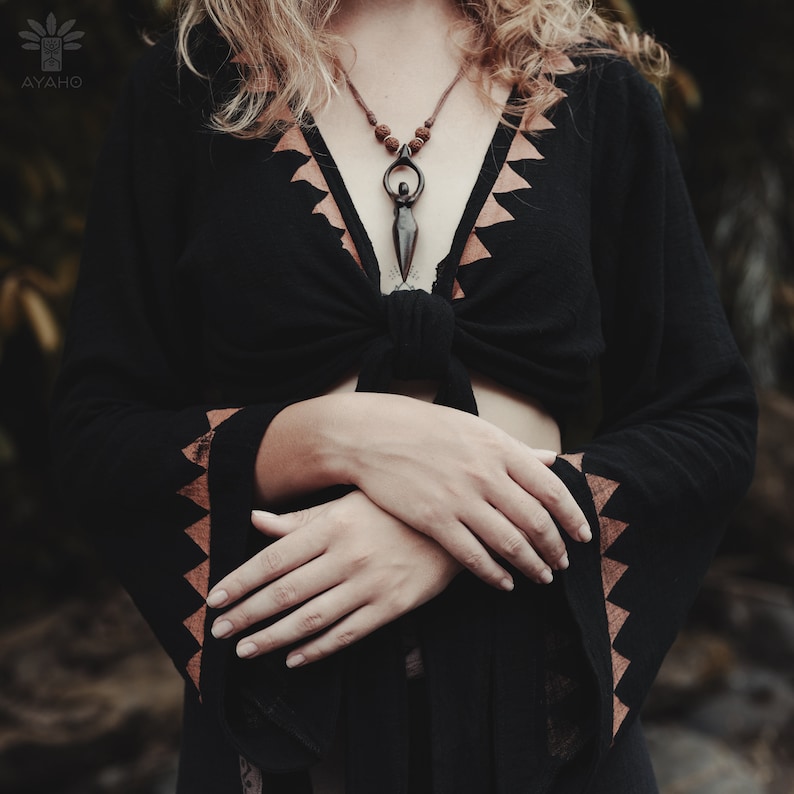Handcrafted carved wood Artemis goddess amulet on a natural wood bead necklace, an ideal one-year anniversary gift symbolizing protection and shamanic tradition